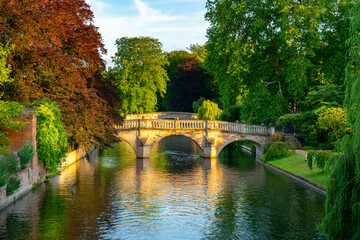 Traditional old stone bridge in Cambridge city in England viewed at golden hour