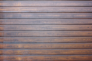 Obraz premium the texture of brown wooden planks with cracks