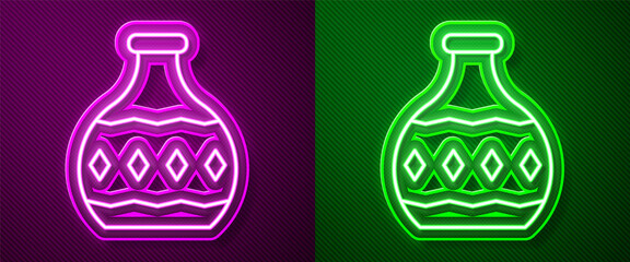 Glowing neon line Tequila bottle icon isolated on purple and green background. Mexican alcohol drink. Vector.