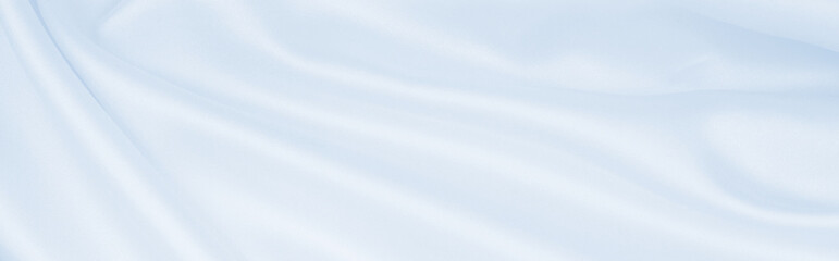 Smooth elegant blue silk or satin luxury cloth texture as abstract background. Luxurious background...