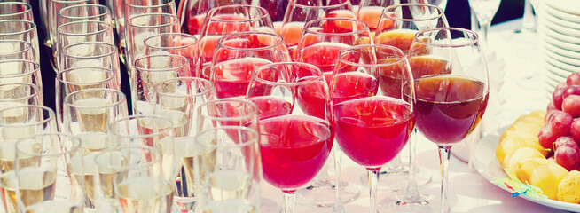 glasses with white and red wine close-up before party in cafe