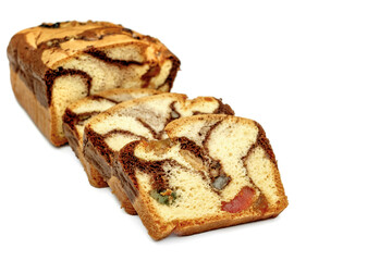 Slices of Romanian sponge cake with cocoa, turkish delight and raisins on white backgrpind