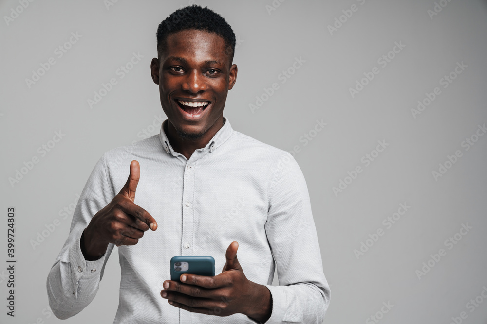 Wall mural Handsome smiling young african busines man