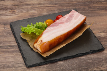 Smoked pork breast with salad leaves