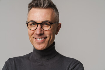 Handsome confident smart looking man posing