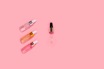 Glass Bottles with fluid collagen and hyaluronic acid, hydration skin. Top flatlay view copyspace. Natural background with hard light