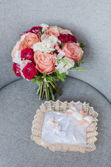 the bride's bouquet, bridal bouquet of roses, bouquet with wedding rings, wedding rings