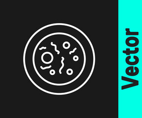 White line Petri dish with bacteria icon isolated on black background. Vector.