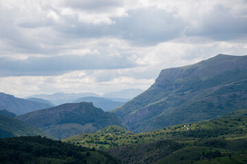 Fototapeta premium Mountain landscape against cloudy sky