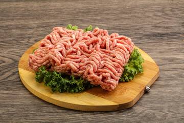Raw pork minced meat over board