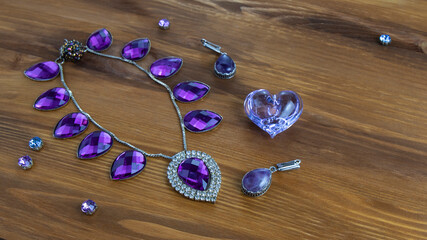 A beautiful jewelry necklace  with purple sparkling stones and amethyst earrings and a violet...