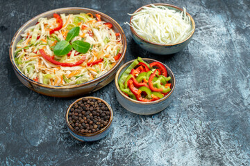 front view delicious vegetable salad with cabbage and bell-peppers on light-grey background health lunch diet color photo