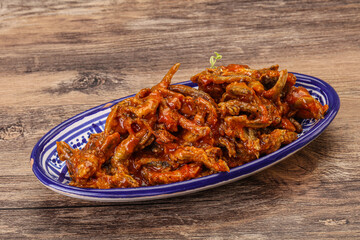 Canned anchovy in tomato sauce