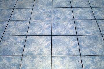 Blue tiles on a bathroom floor
