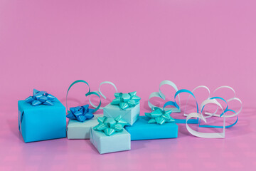 Love hearts and gifts on pink background.