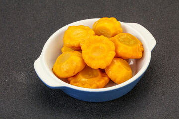 Marinated yellow patisson in the bowl