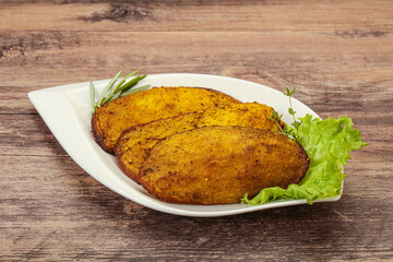 Baked potato with herbs and spices