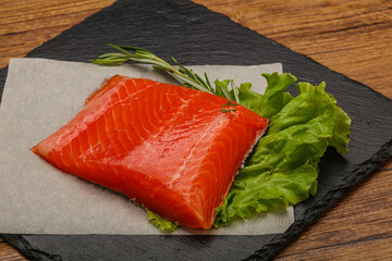 Salmon piece steak served rosemary