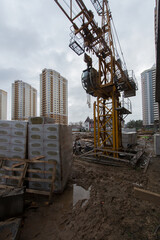 Winter, construction site, tower crane production of social housing.
