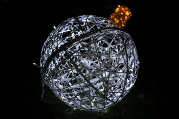 Sparkling ball with white festive lights.