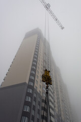 Tower crane. Construction site. Production of apartments, social housing.