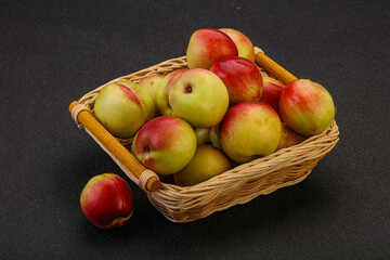 Sweet small nectarines in the basket