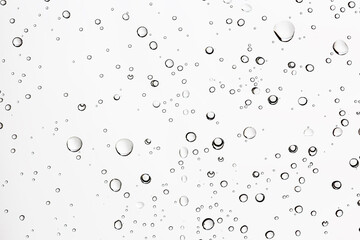 white isolated background water drops on the glass / wet window glass with splashes and drops of water and lime, texture autumn background