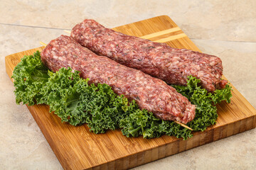 Raw minced beef kebab skewer