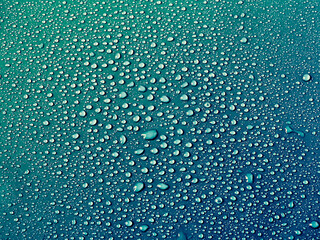 Water drops on turquoise background.