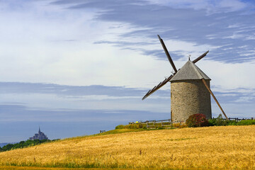 Windmill in a corn field, Moidrey near Mont St Michel, Normandy, France © Pecold