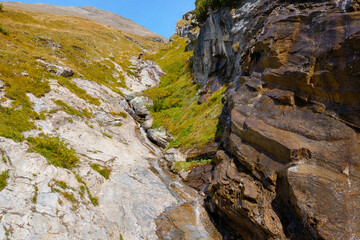Bottom view of the rocky area. Water flows down the slope.