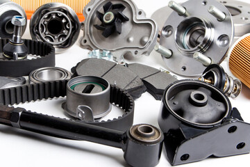 New car parts background .Hub, pump, brake pads, filter, timing belt, rollers, cv joints,...