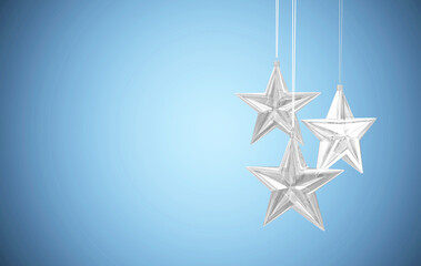 Glass Star Toys Hanging on blue studio background