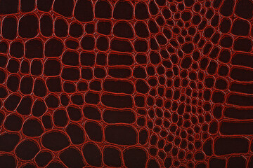 Crocodile skin texture in brown color. Natural alligator leather. Brown reptile leather imitation...