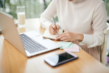 asian woman using computer in room