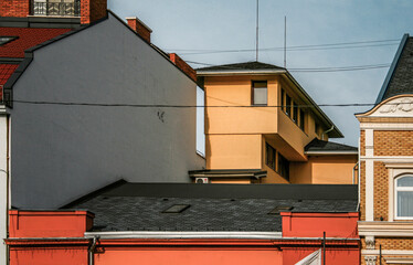 facades of old houses against the blue sky with negative space