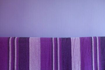  Sofa backrest and home wall in shades of purple