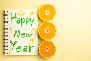 top view fresh tangerine slices with happy new year note on white background photo citrus color orange