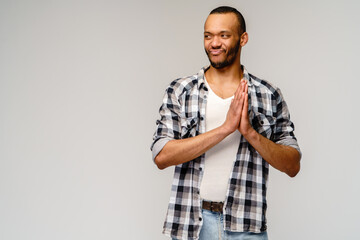 Closeup portrait of happy young handsome african-american man rubbing hands together in anticipation