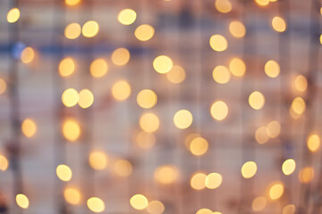 Square background bokeh of sparkling golden festive lights