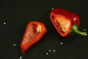 Red peppers on black background