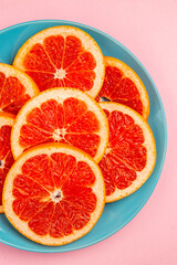 top view tasty grapefruits fruit slices inside plate on pink background fresh citrus fruits juice mellow color diet