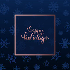happy holidays Hand drawn brush pen lettering in golden rose frame on blue background with snowflakes. Trendy template of Merry Christmas and Happy New Year greeting card