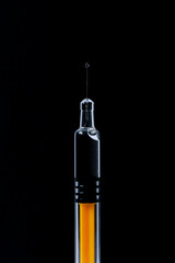 syringe isolated on black background