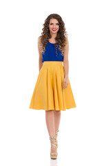 Smiling Beautiful Woman Is Walking Towards Camera