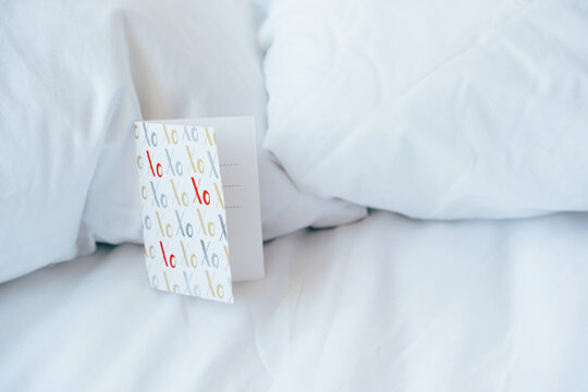 Love card in bed, concept of love and valentine's day and honeymoon.