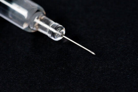 syringe isolated on black background