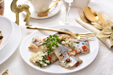 herring slices marinated in oil for Christmas