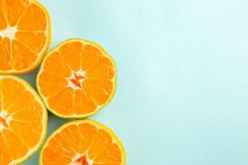 top view fresh tangerine slices on light-blue background citrus photo fruit color juice orange