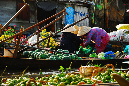 Vietnamese women selling watermelons on the floating market